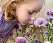 girl smelling flower