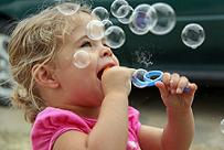 girl blowing bubble